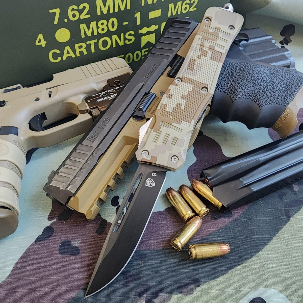 OTF Knife and ammunition on a camouflage surface