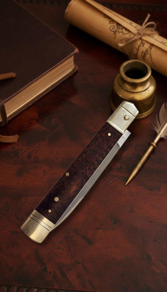 Italian Leverlock knife with 9-inch blade and elegant snakewood handle, featuring satin plain finish for durability