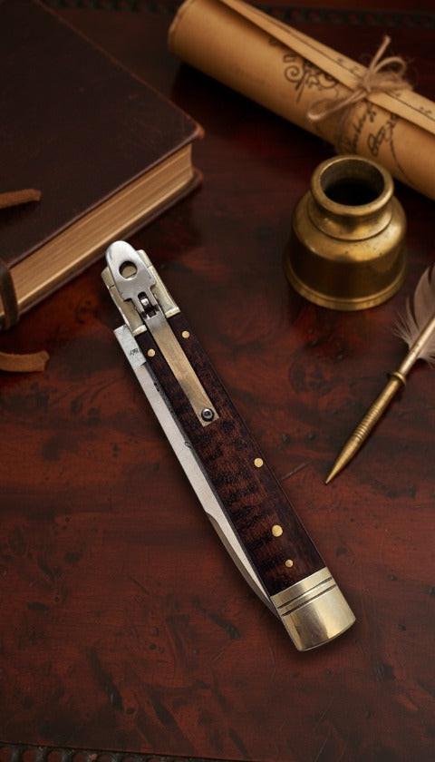 Italian Leverlock knife with 9-inch blade and elegant snakewood handle, featuring satin plain finish for durability