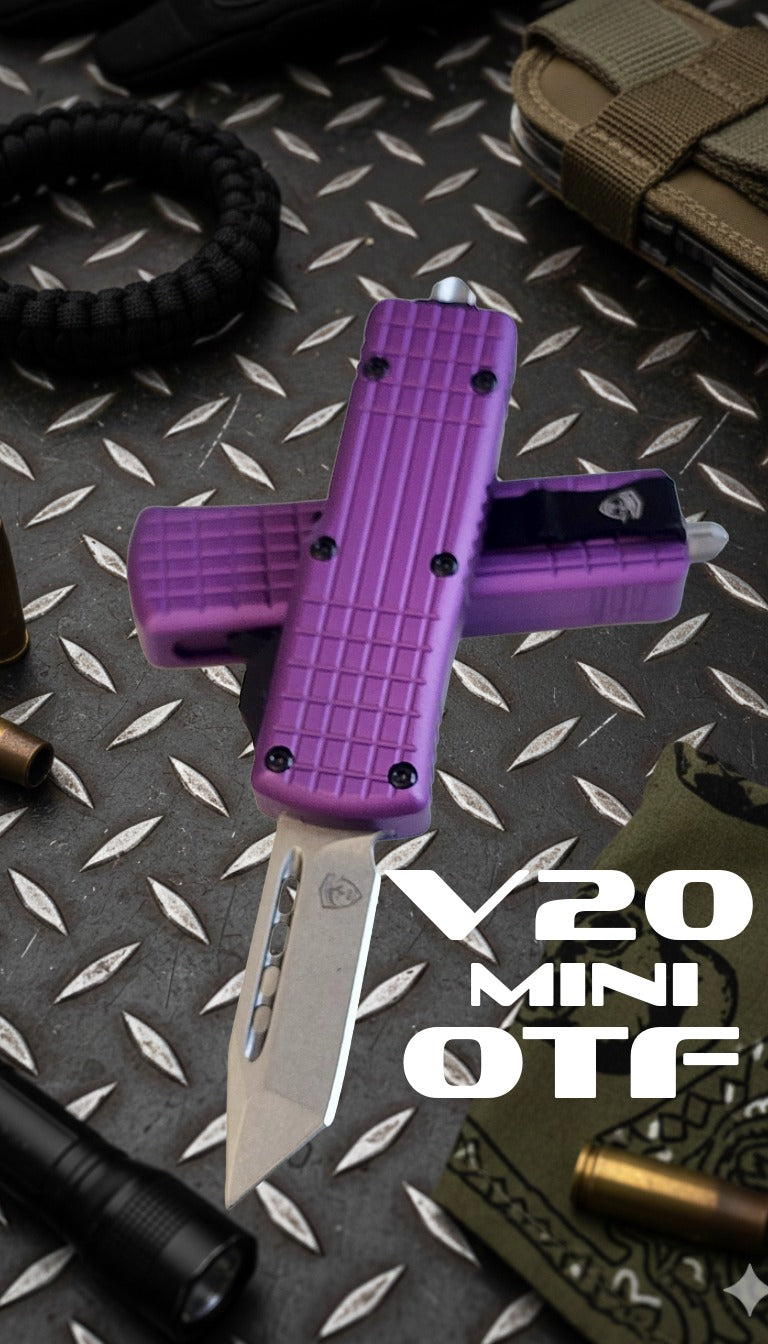 Purple V20 Mini OTF knife on a textured surface with visible branding.