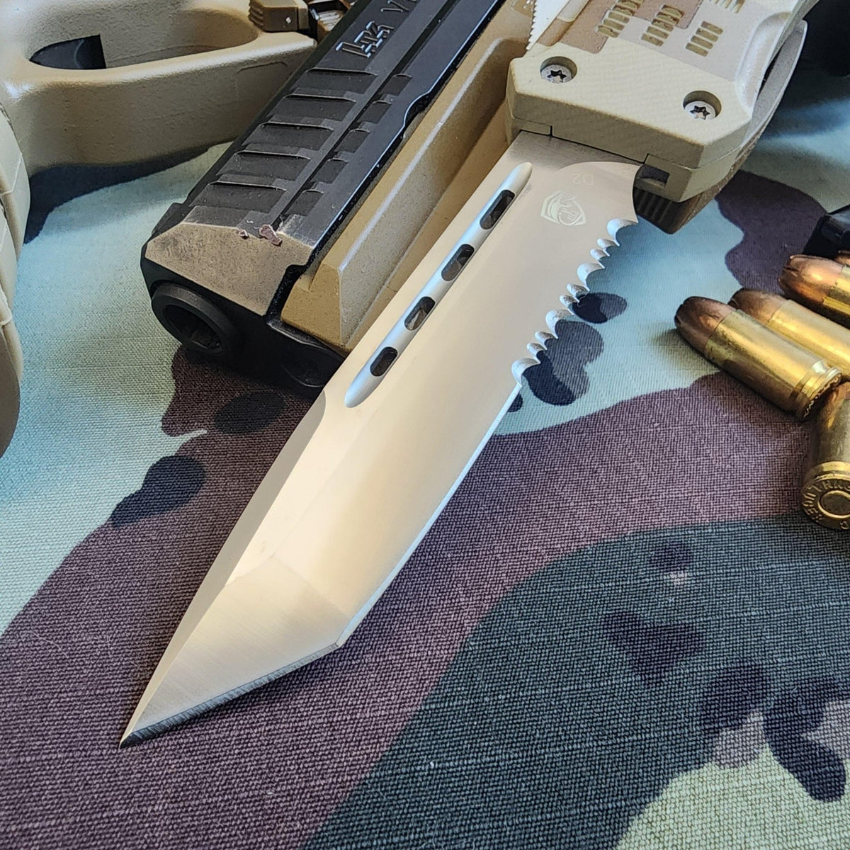 Folding knife with a camouflage pattern background