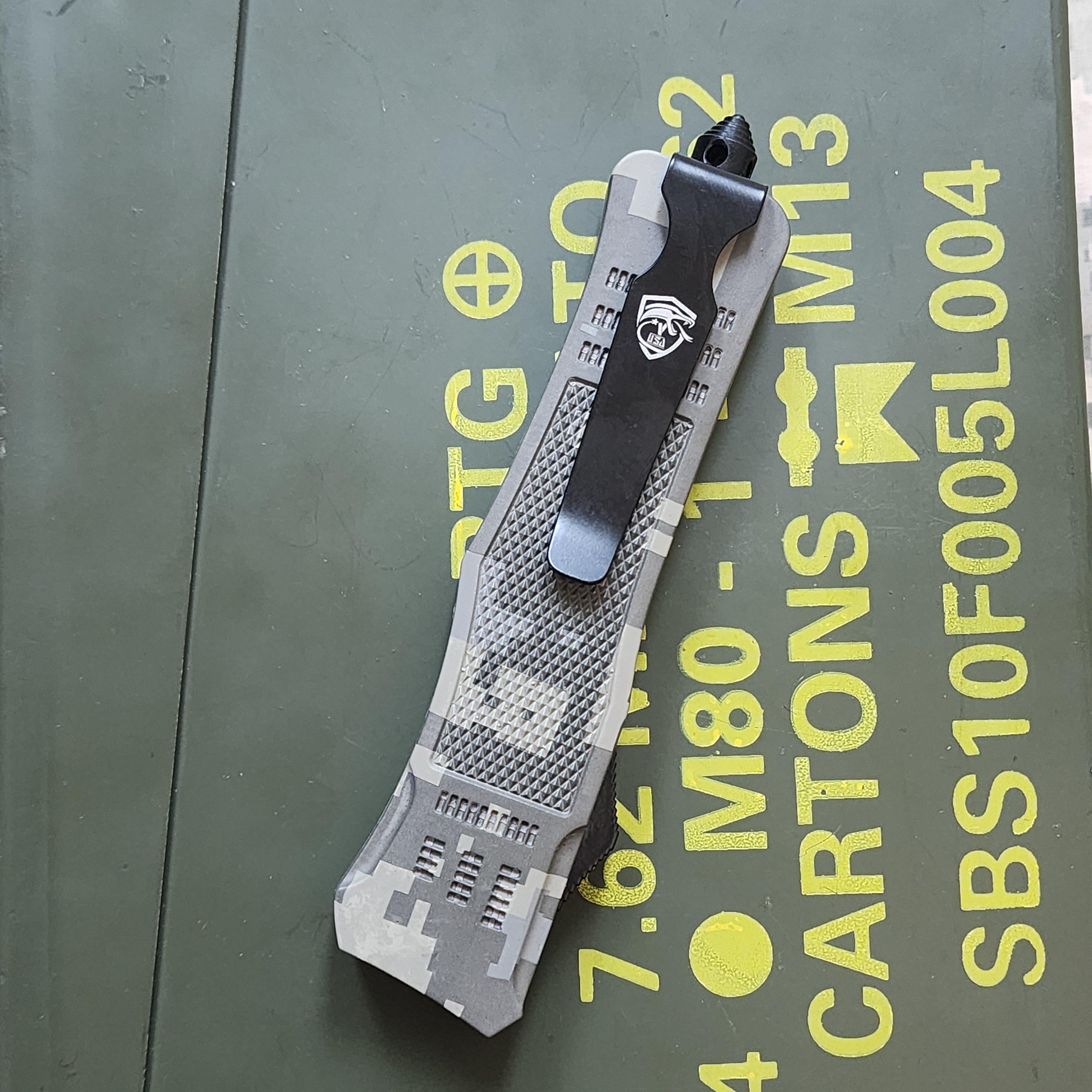 Tool with a textured handle on a green surface with yellow text