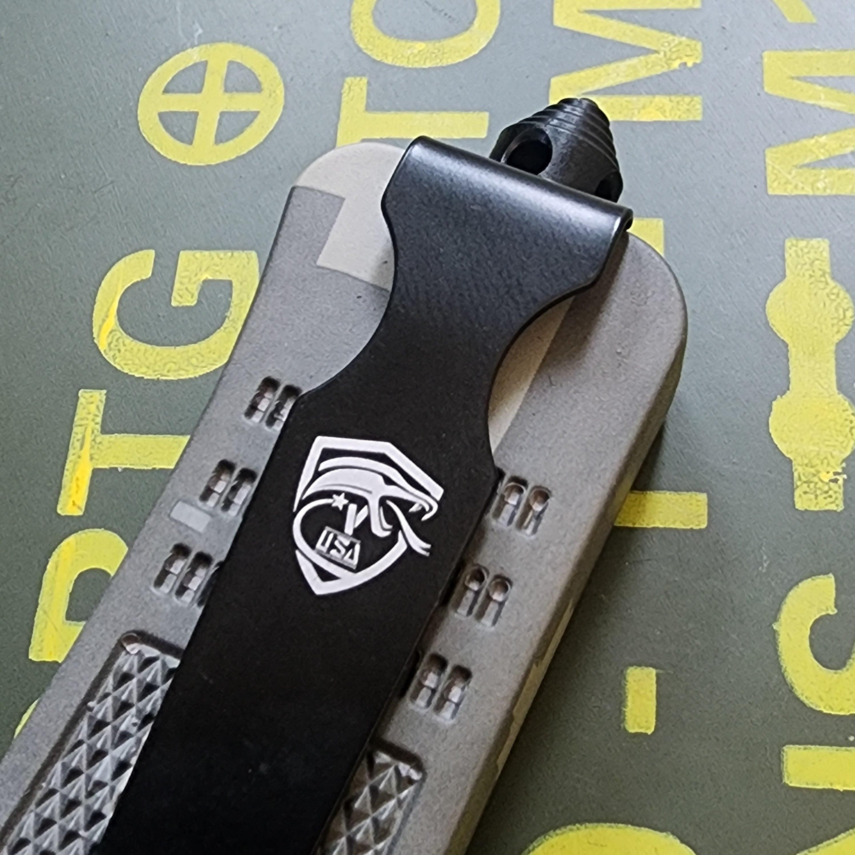 Close-up of a pocket knife with a brand logo on a textured background