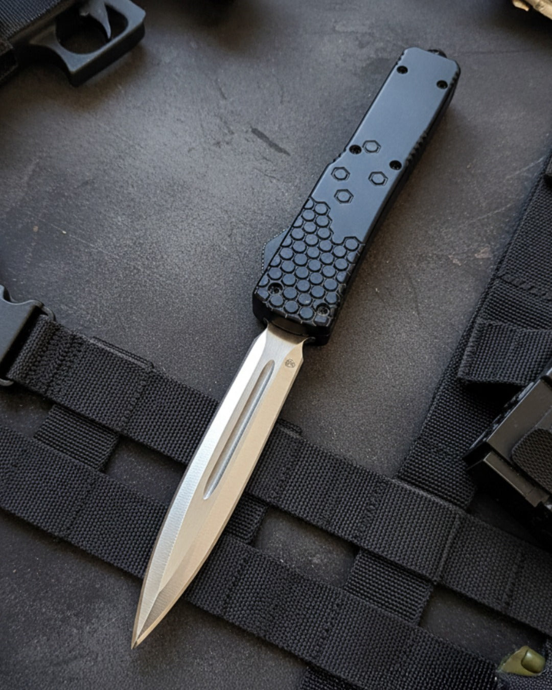 Knife with a black handle and silver blade on a tactical background