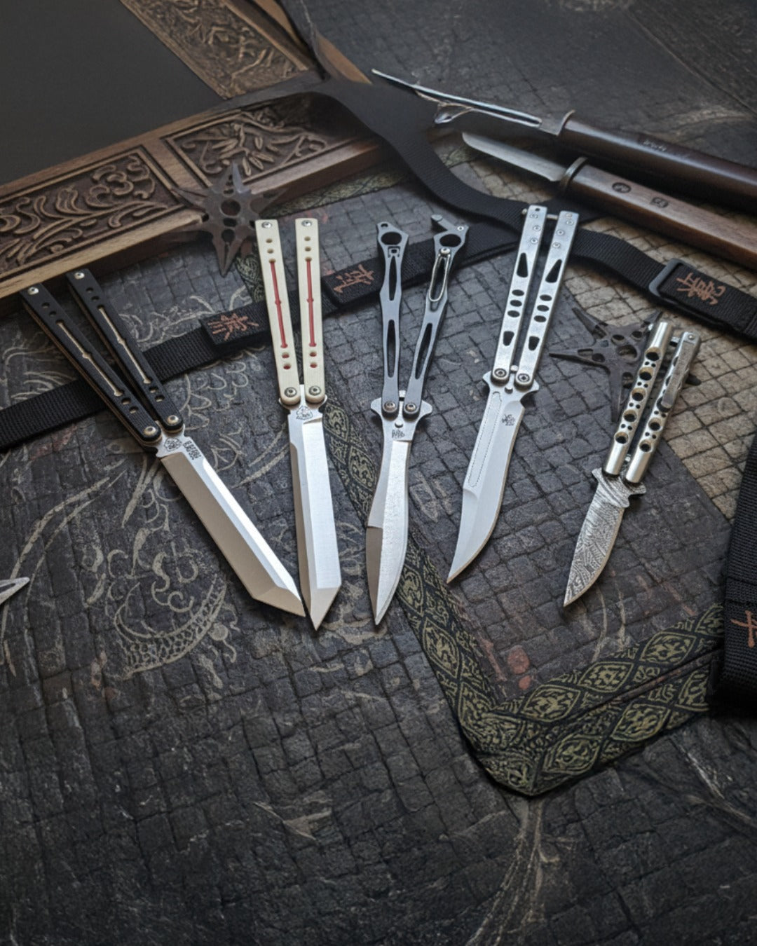 Butterfly Knife Collection on Asian inspired Background