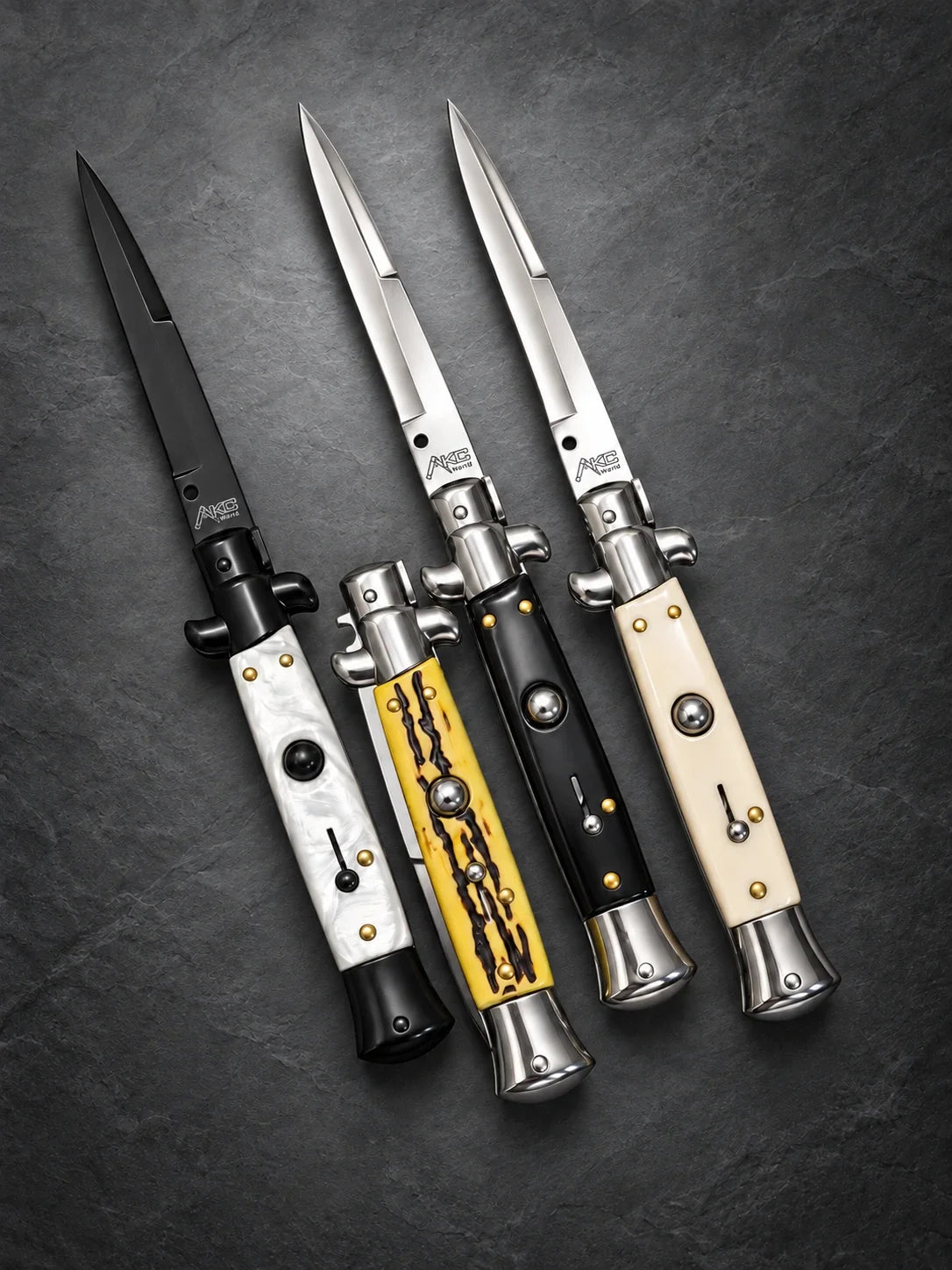 classic Italian stiletto switchblade knives with pearl-style, yellow patterned, black and ivory-style handles.