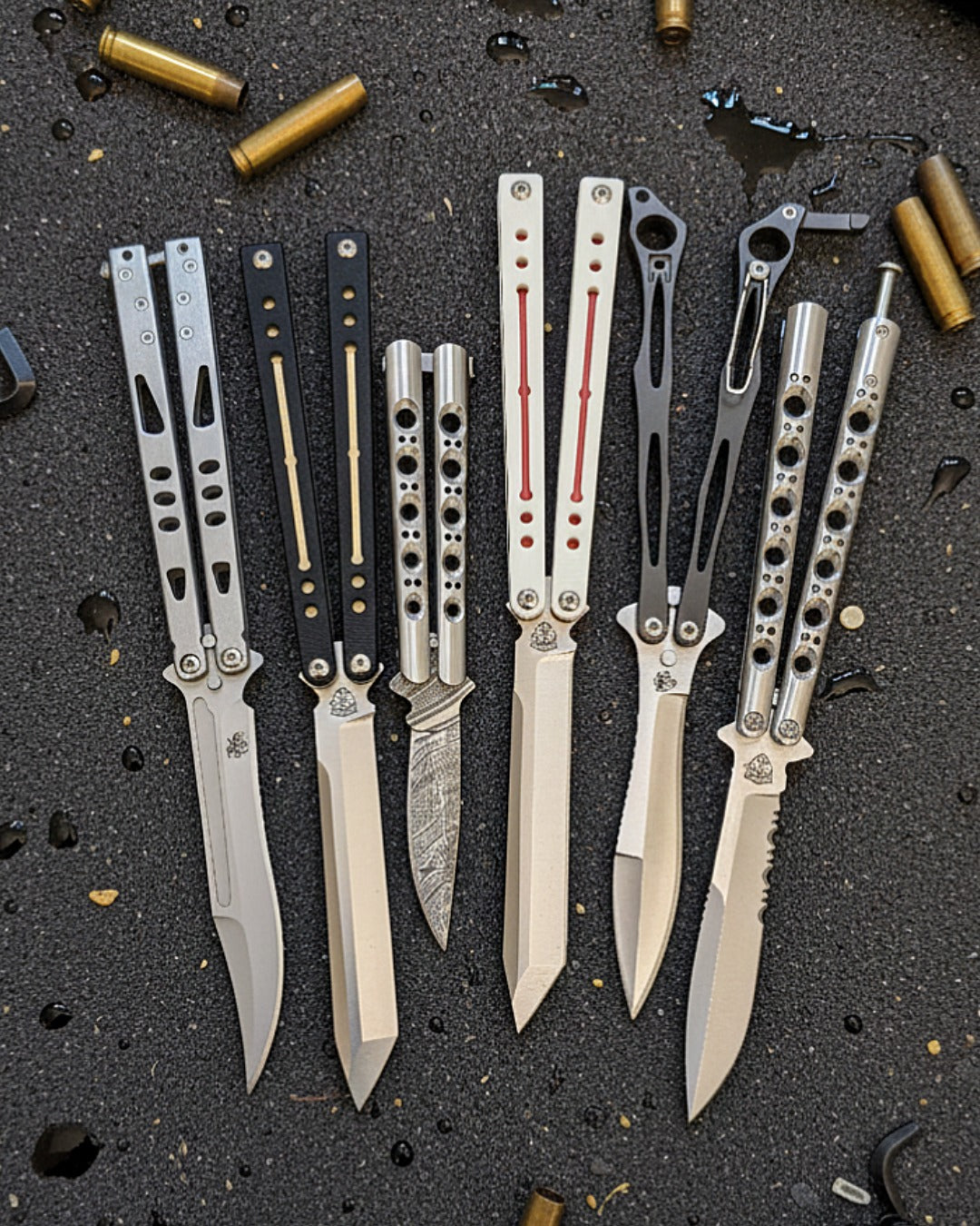 Premium balisong knives for sale featuring multiple butterfly knife designs with sharp blades, machined handles, and professional craftsmanship