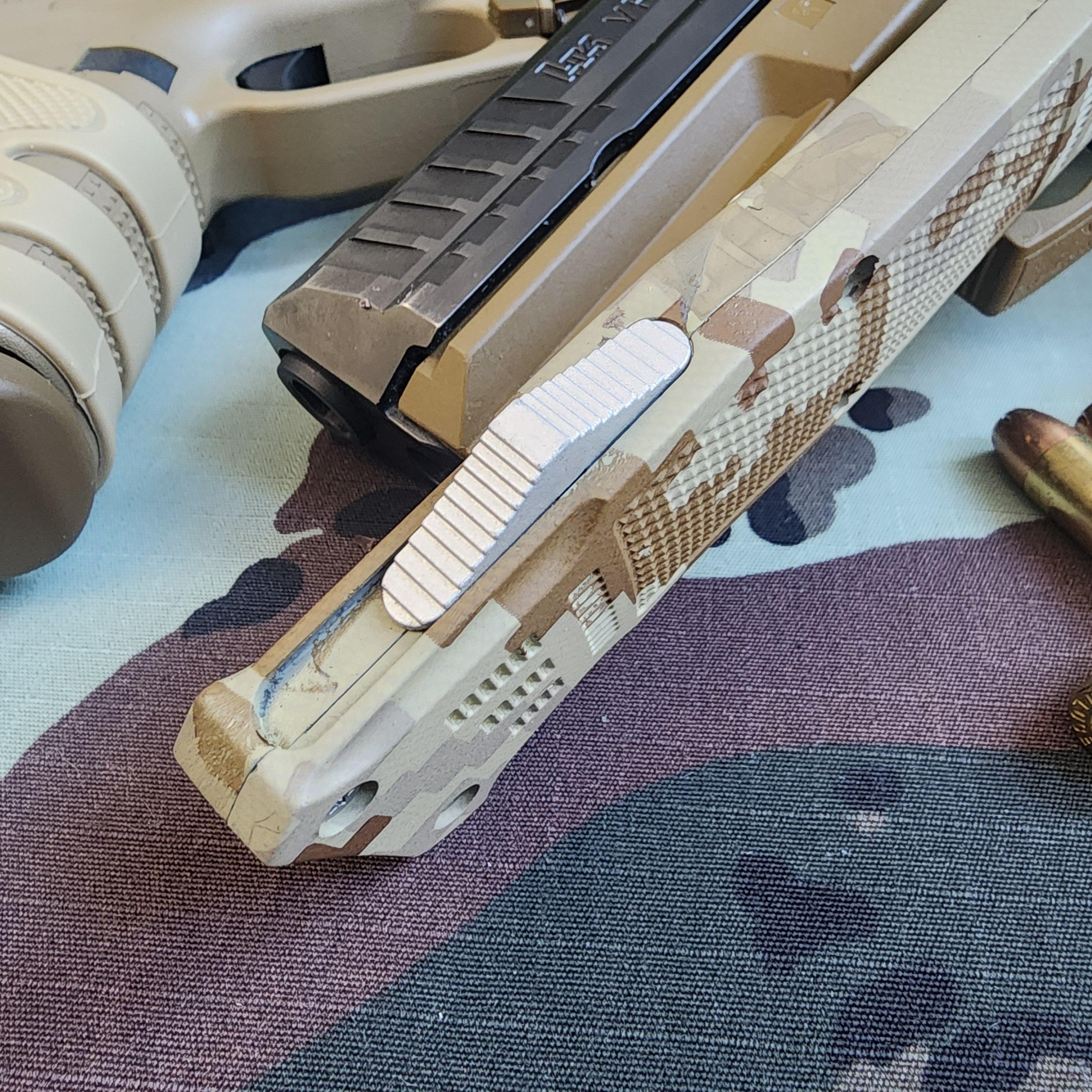 Close-up of a tactical knife with a camouflage handle on a textured surface