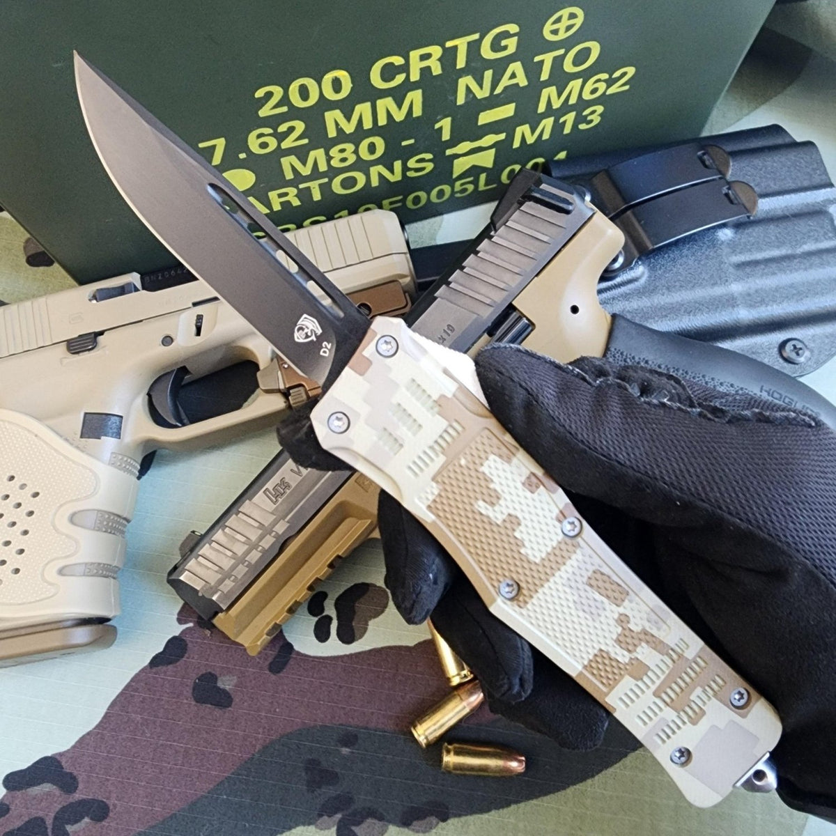 Tactical knife with camouflage handle held by a gloved hand, surrounded by tactical gear.