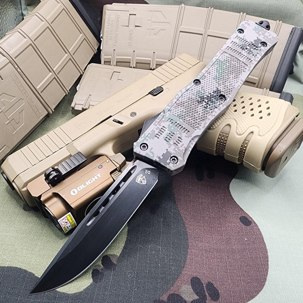 Venom 4TR ELITE Tactical OTF knife with Recon Camo and Black DP 3.4 inch blade, perfect for tactical use.