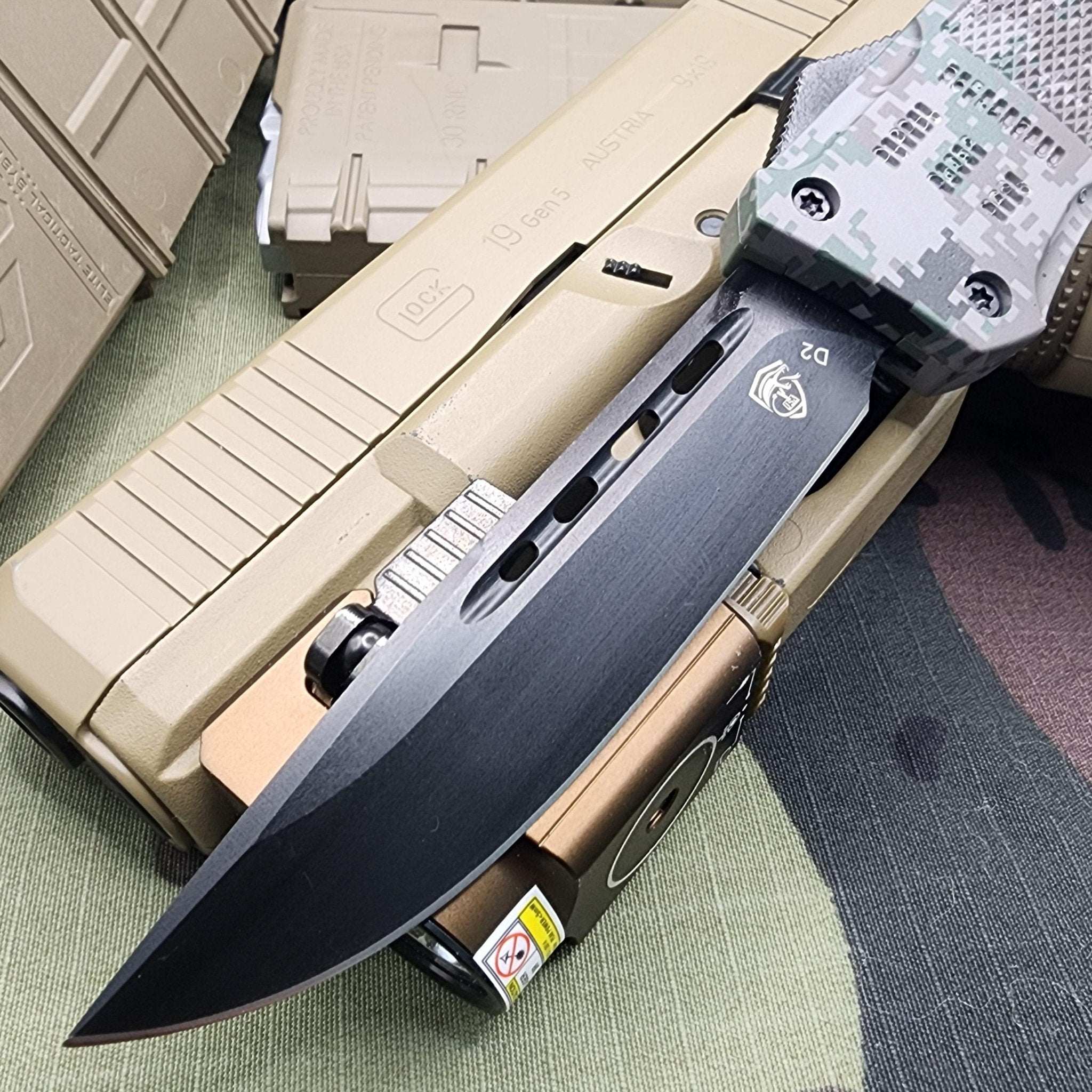 Venom 4TR ELITE Tactical OTF knife with Recon Camo and Black DP 3.4 inch blade, perfect for tactical use.