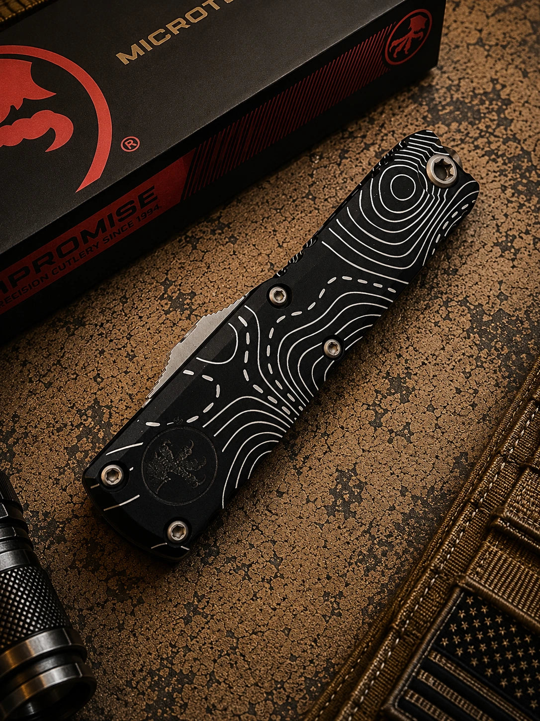 Microtech UTX-85 Gen IV OTF Automatic Knife – Black Topographic Handle | Stonewash Full Serrated Tanto M390MK® | 12334-12TP