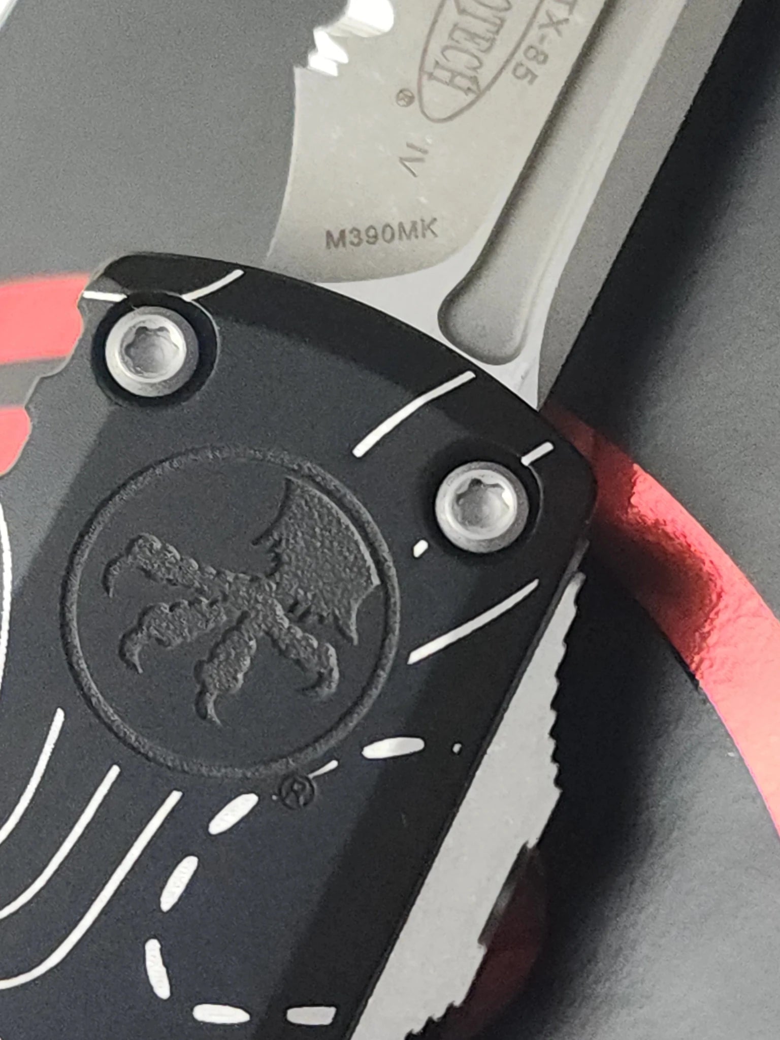 Microtech UTX-85 Gen IV OTF Automatic Knife – Black Topographic Handle | Stonewash Full Serrated Tanto M390MK® | 12334-12TP