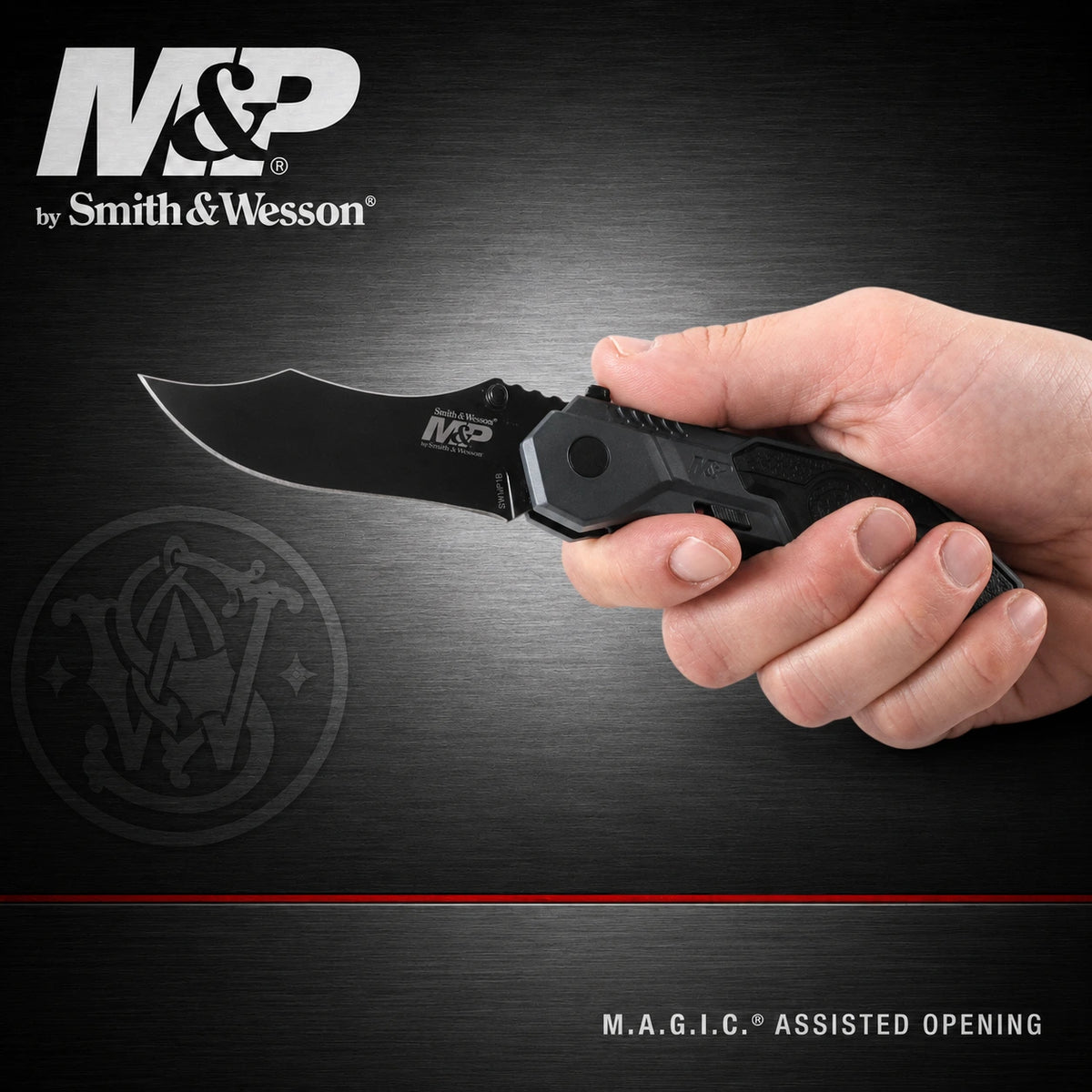 A hand holding an M&P by Smith & Wesson folding knife with a black blade and textured black handle, set against a dark brushed metal background with the M&P logo in the top left.