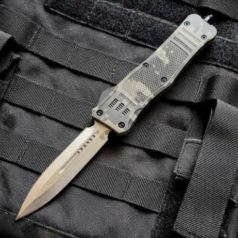 OTF knife with tactical sheath on a black tactical background