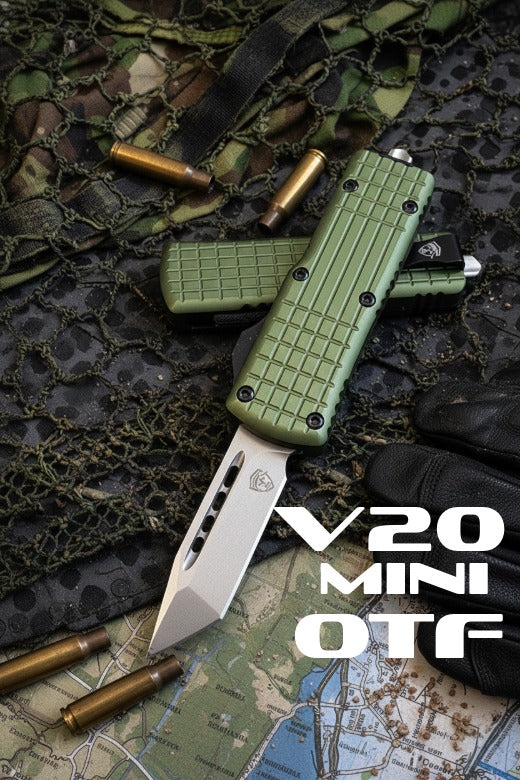 Green V20 Mini OTF knife on camouflage fabric with bullets and a map