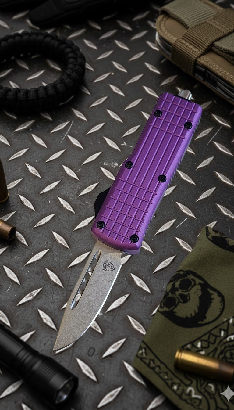 Purple knife with tactical sheath on a diamond plate background