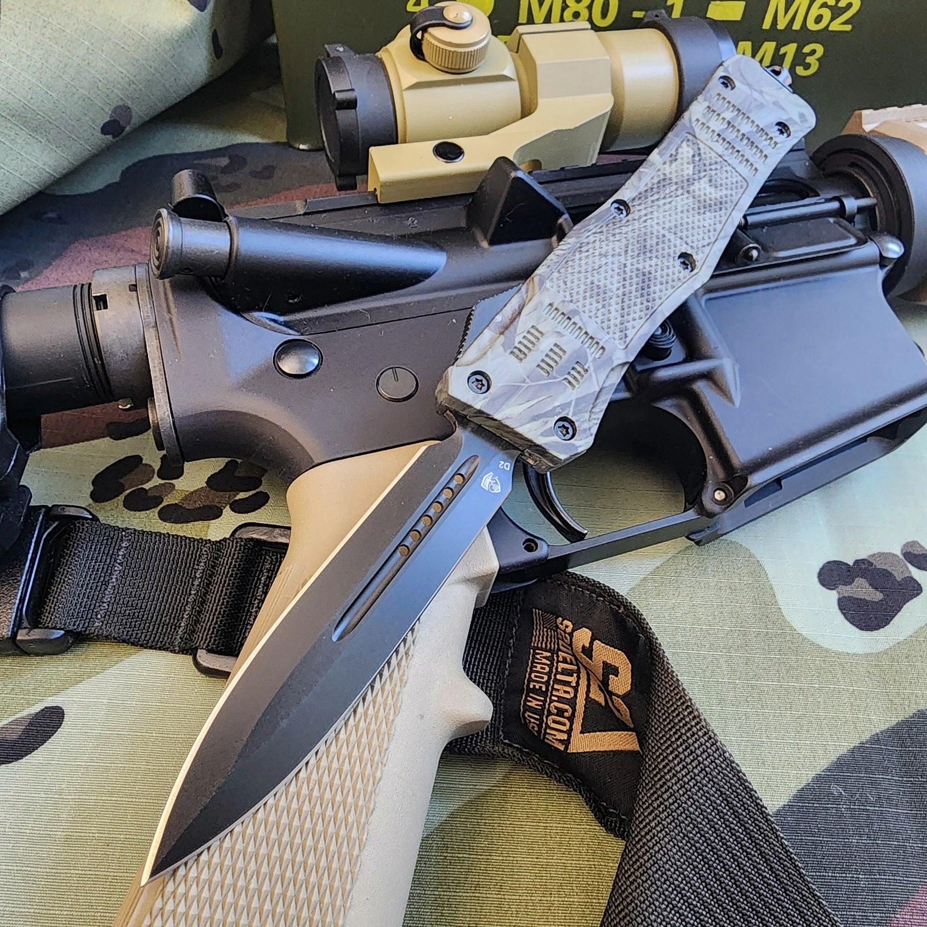 Folding knife with tactical sheath on a camouflage surface