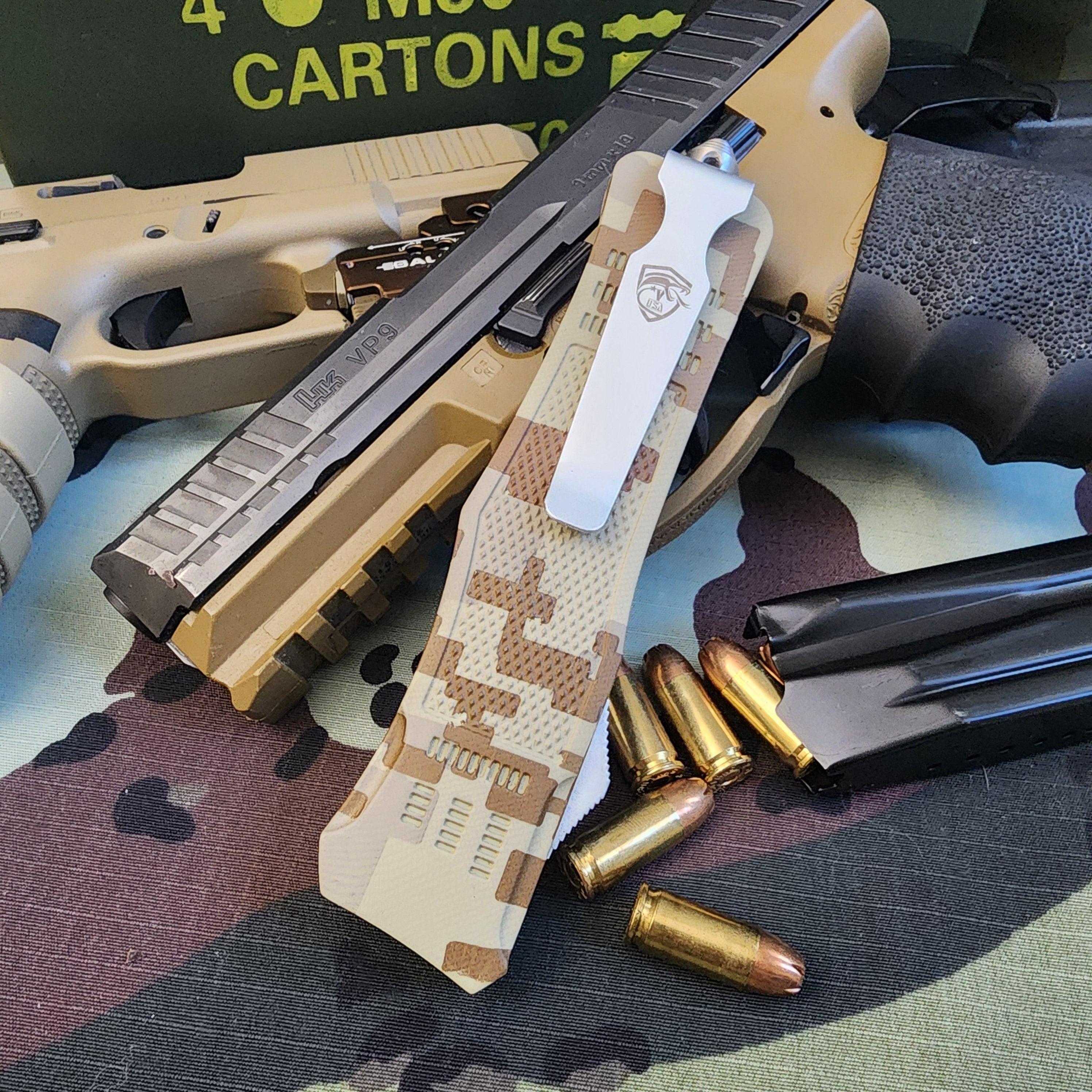 Camouflage-patterned knife with a tactical sheath on a camouflage surface with ammunition.