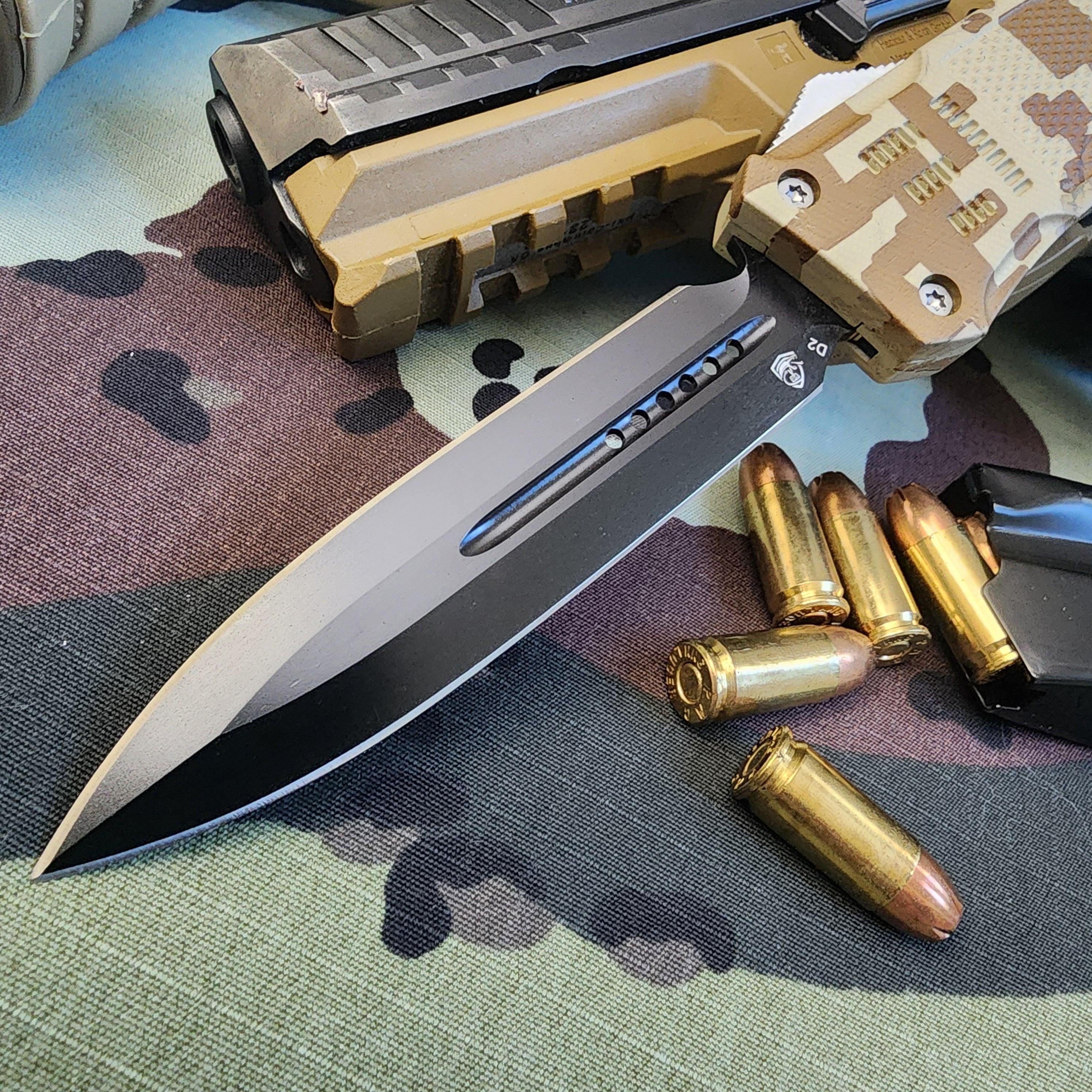 Knife with a gun and bullets on a camouflage-patterned surface