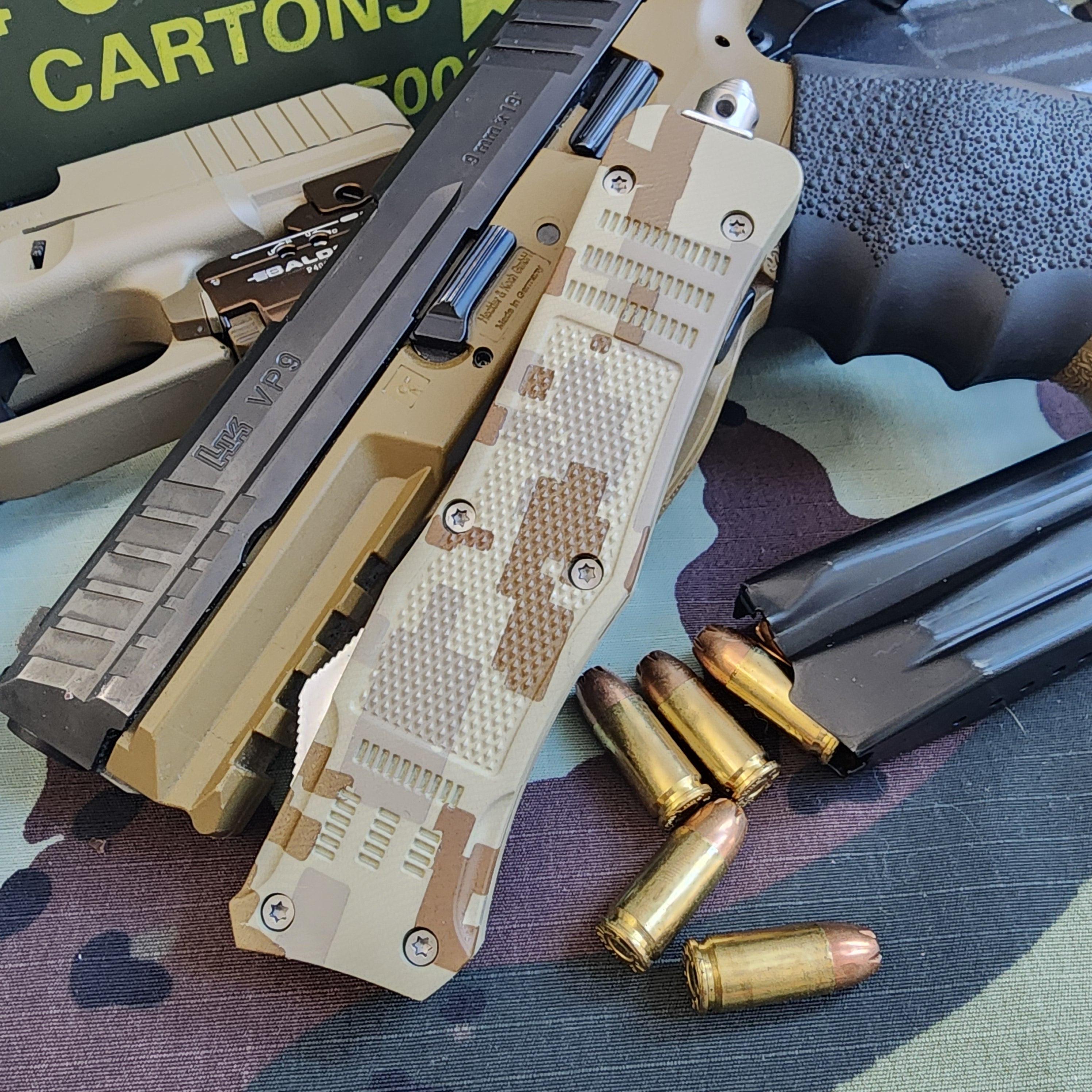 Camouflage-patterned knife with bullets on a camouflage surface