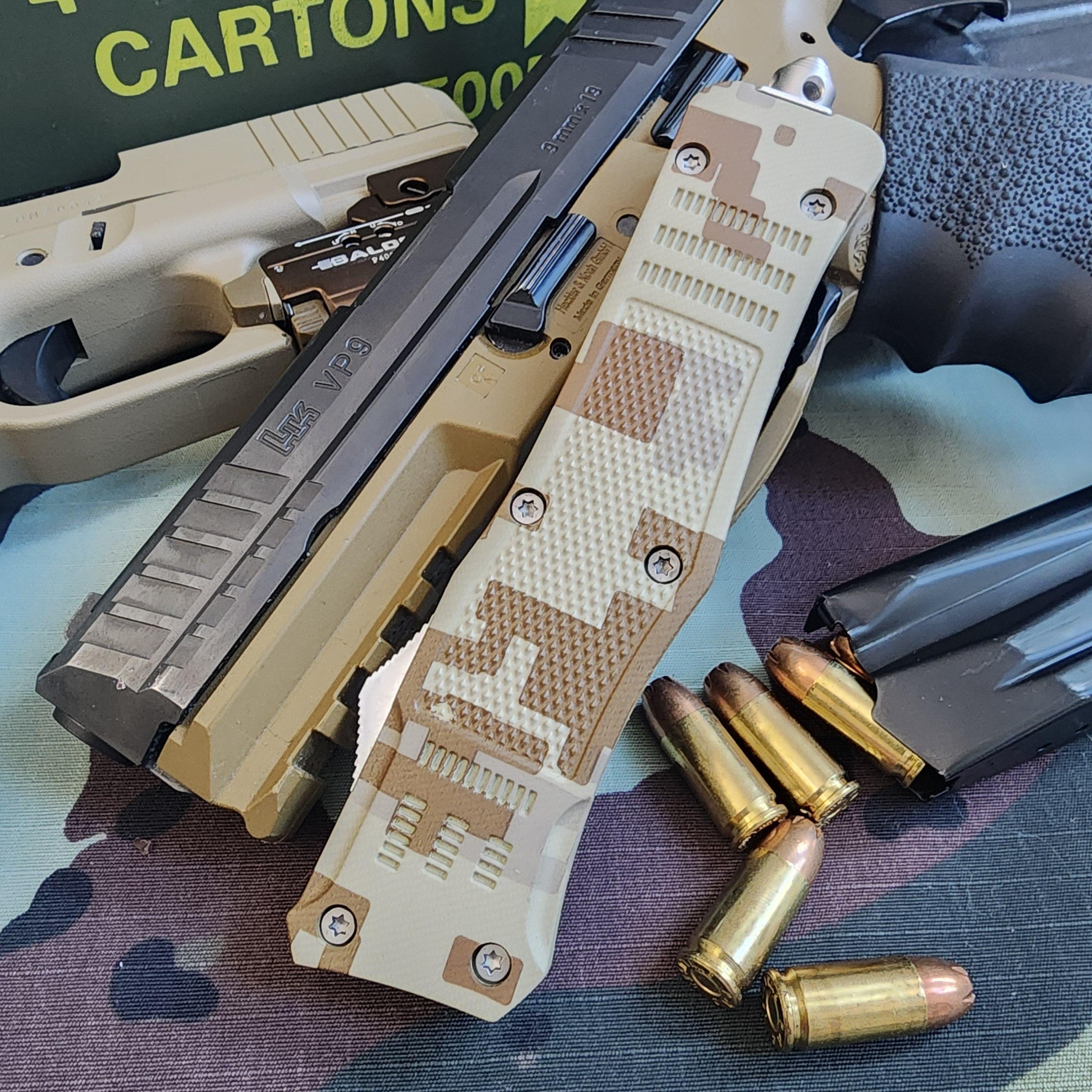 Camouflage handgun with bullets on a camouflage-patterned surface