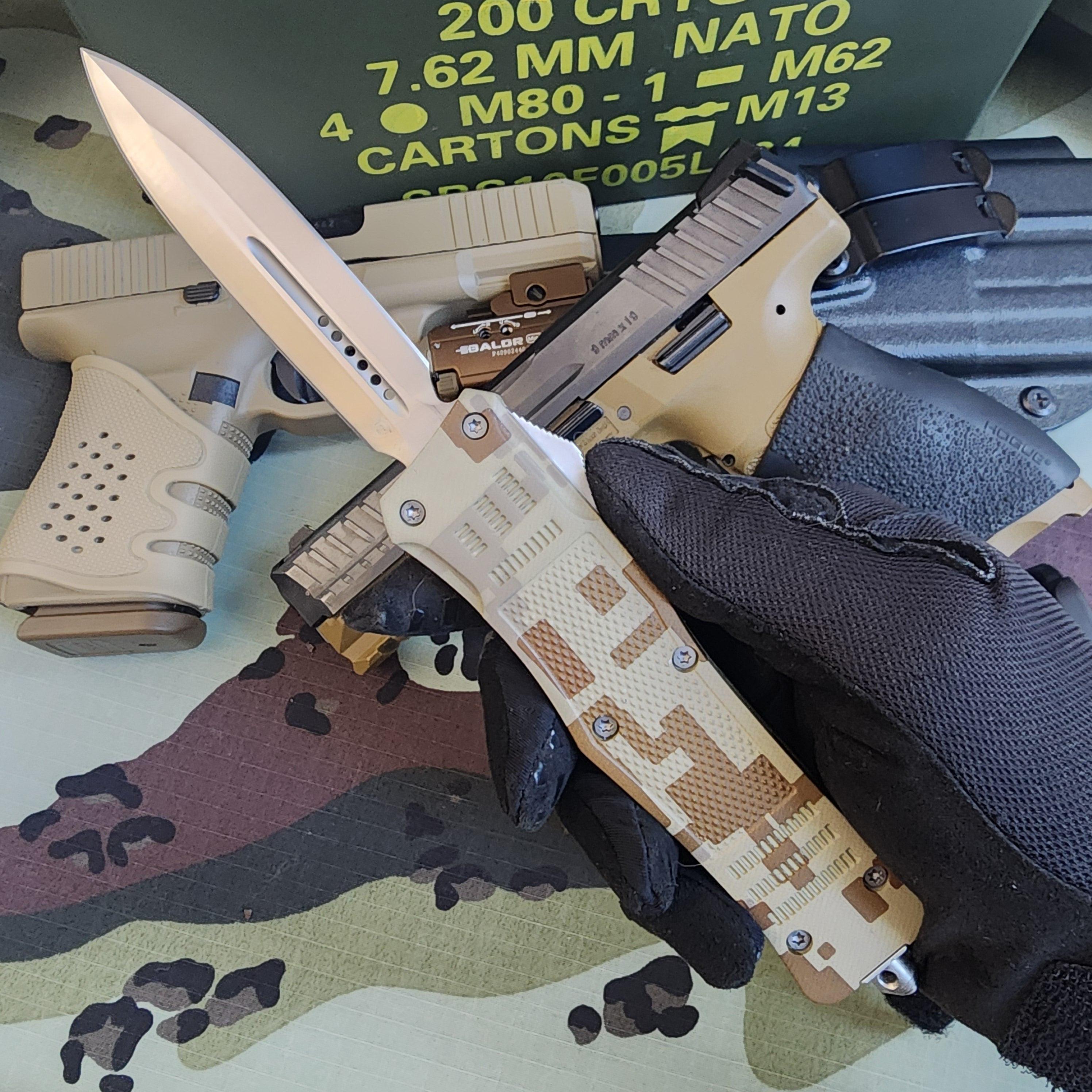 Knife and gun on a camouflage surface with tactical pouches.