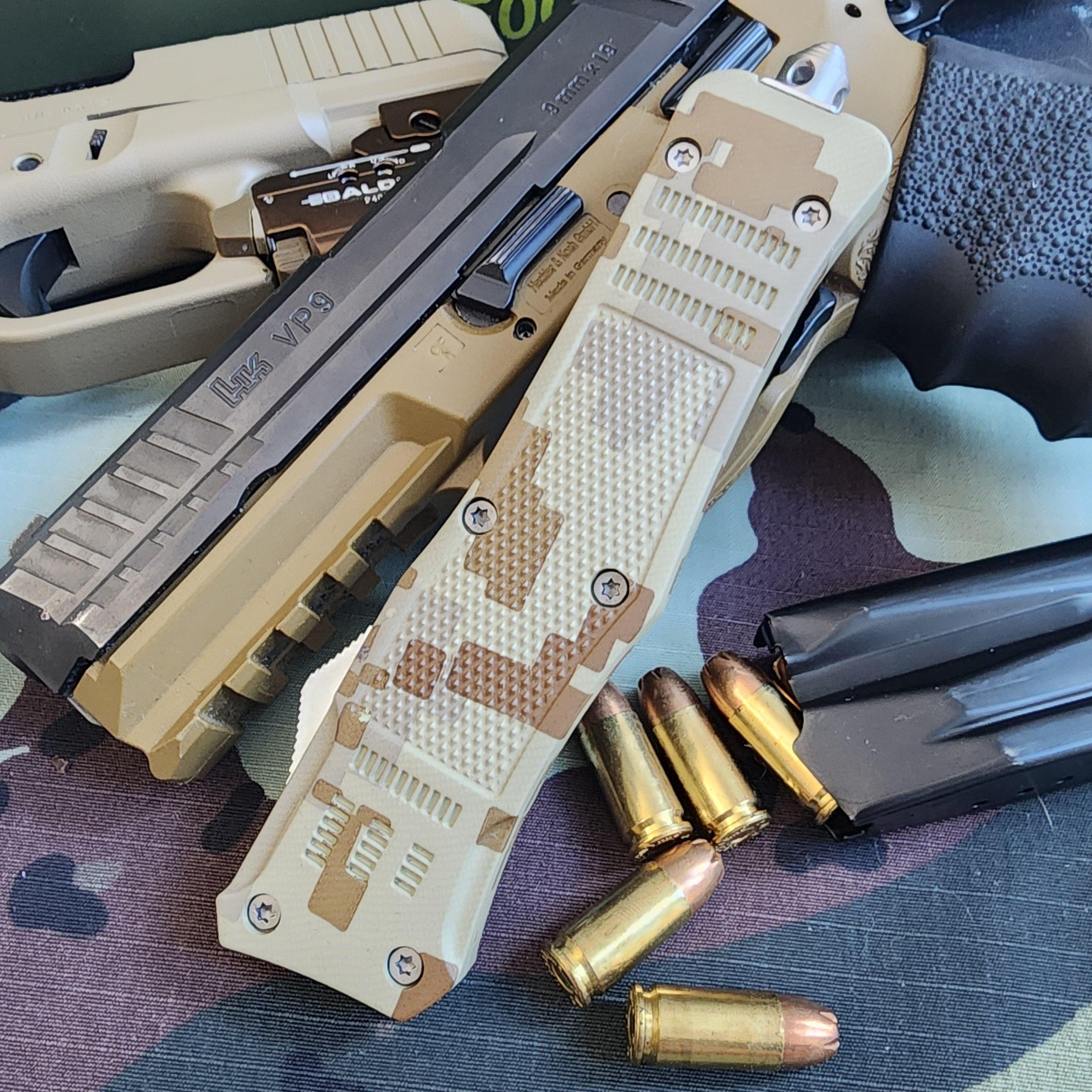 Tan handgun with magazine and bullets on a camouflage surface