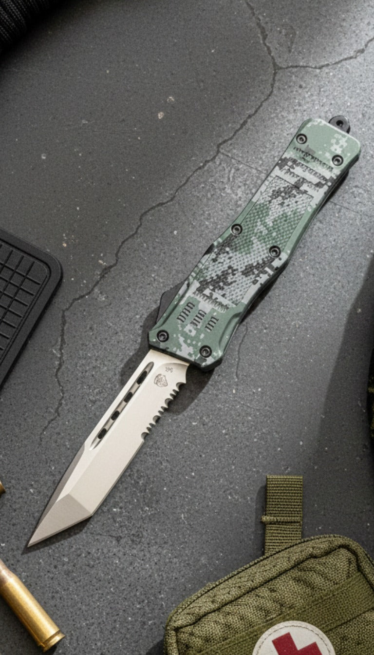 Camouflage pocket knife on a gray surface with a first aid kit and ammunition nearby