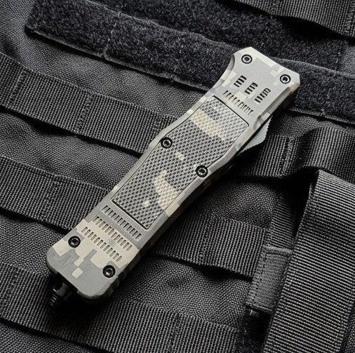 Tactical knife on a black tactical vest