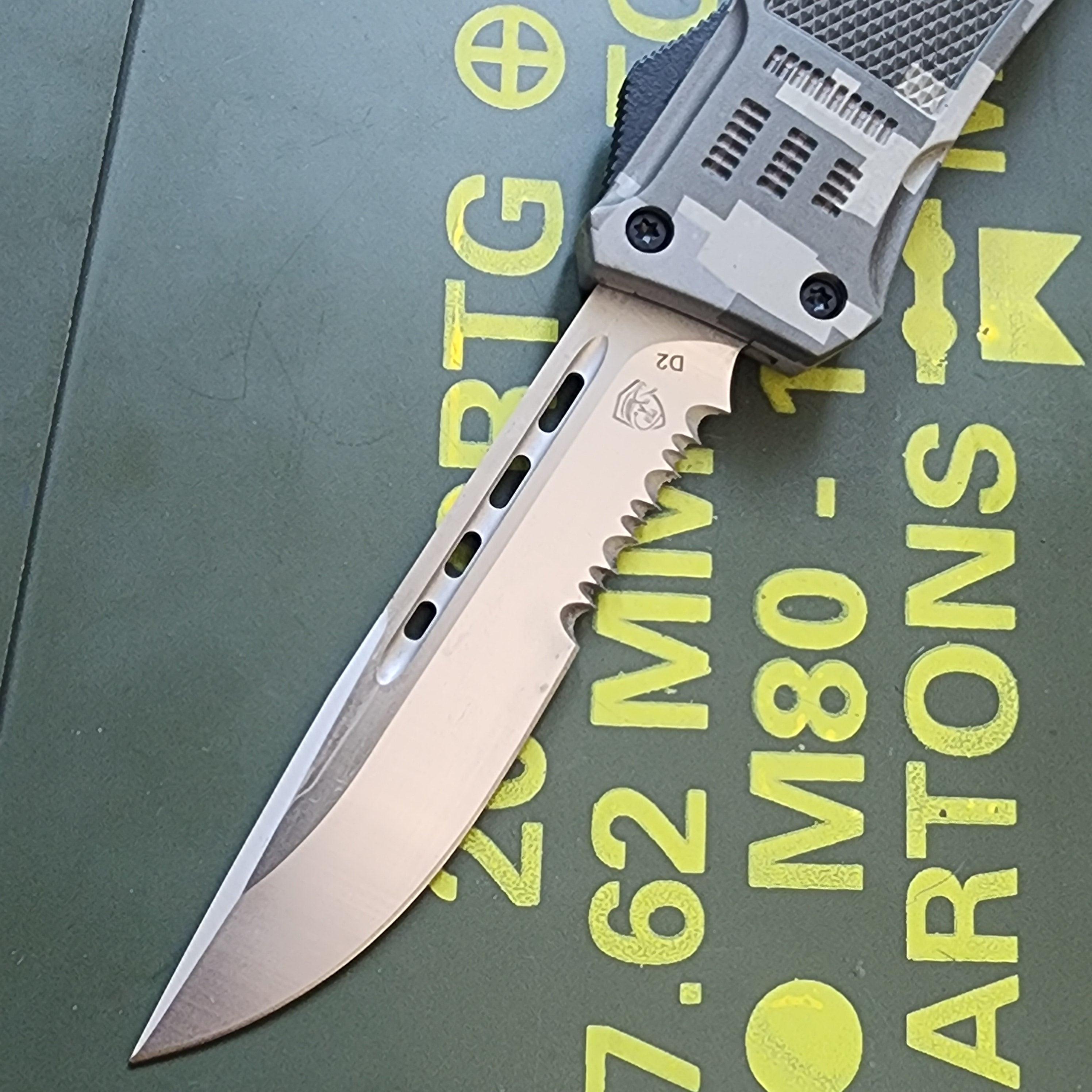 Folding knife with a metallic blade on a green background with text