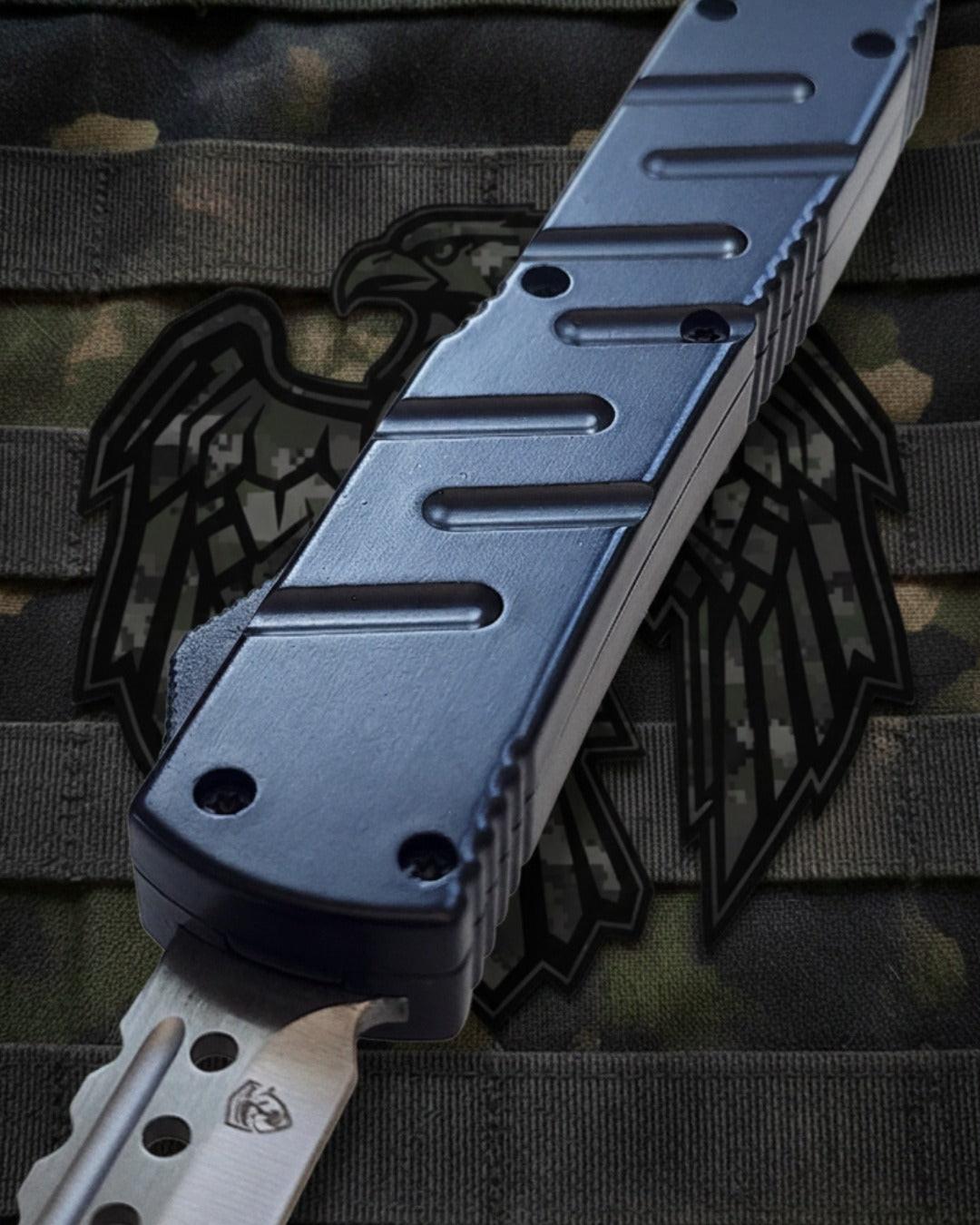 OTF Automatic knife with Black handle on a camouflage background