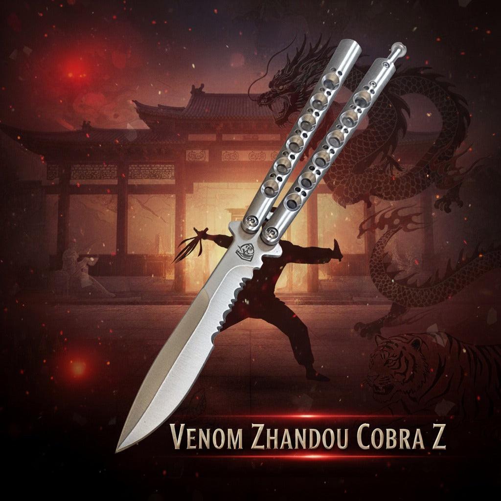 Balisong knife with dragon and traditional building in the background, featuring the brand 'Venom Zhandou Cobra Z'.